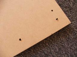 Holes drilled into table top